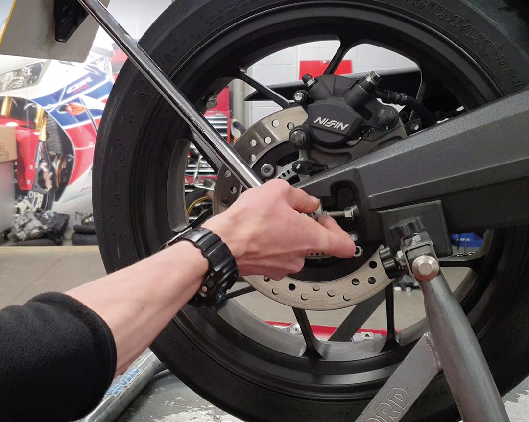 Honda how to tighten your chain - loosen up the axle step one