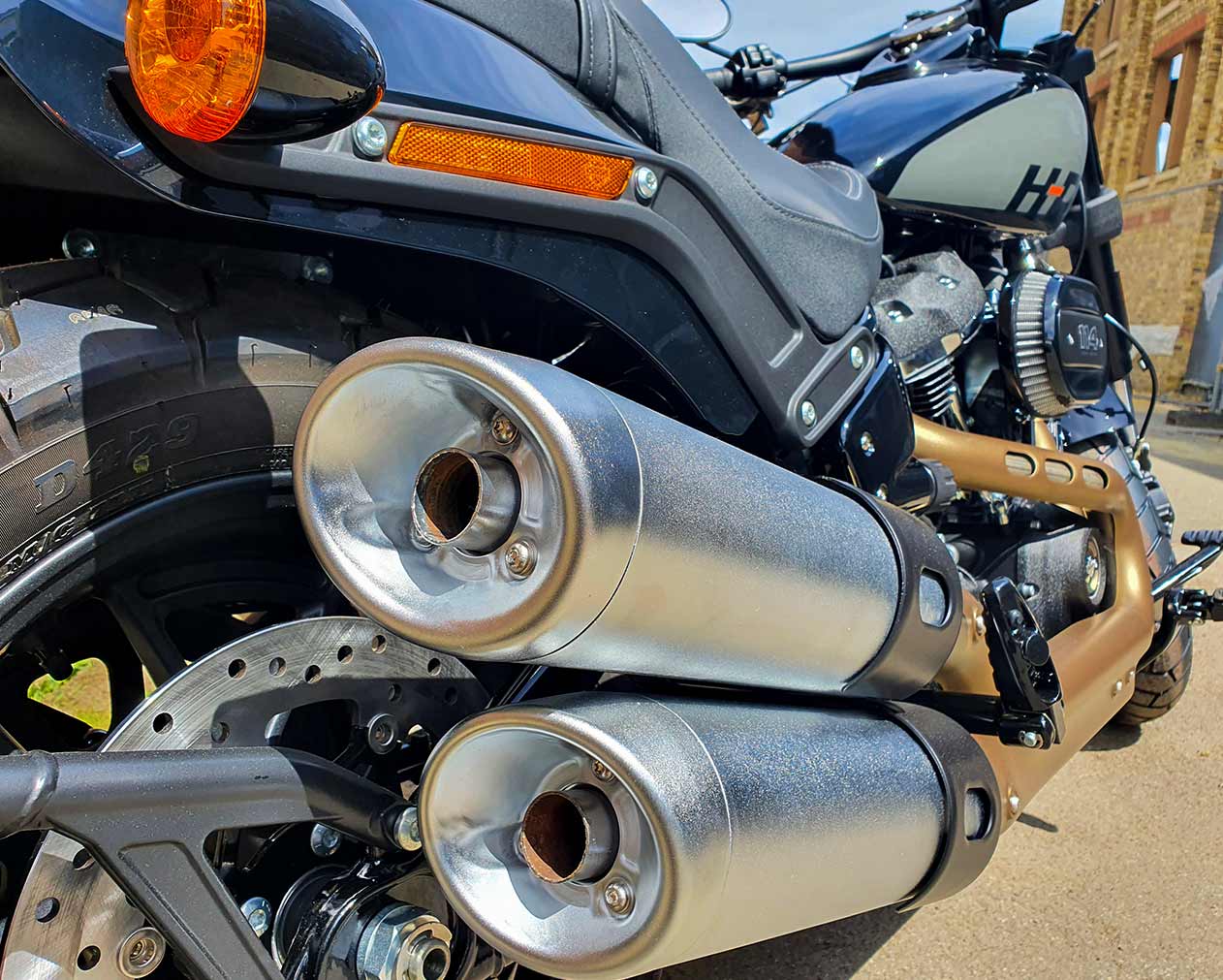 Fat Bob from rear, by the double exhaust mufflers