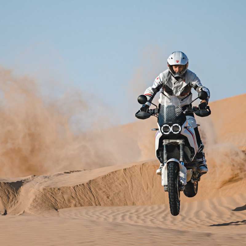 Ducati Desert X on sand hills