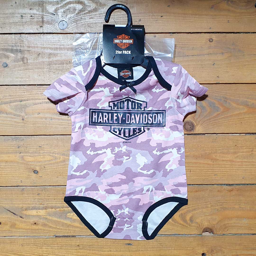Combat pink baby grow with Harley-Davidson logo on chest