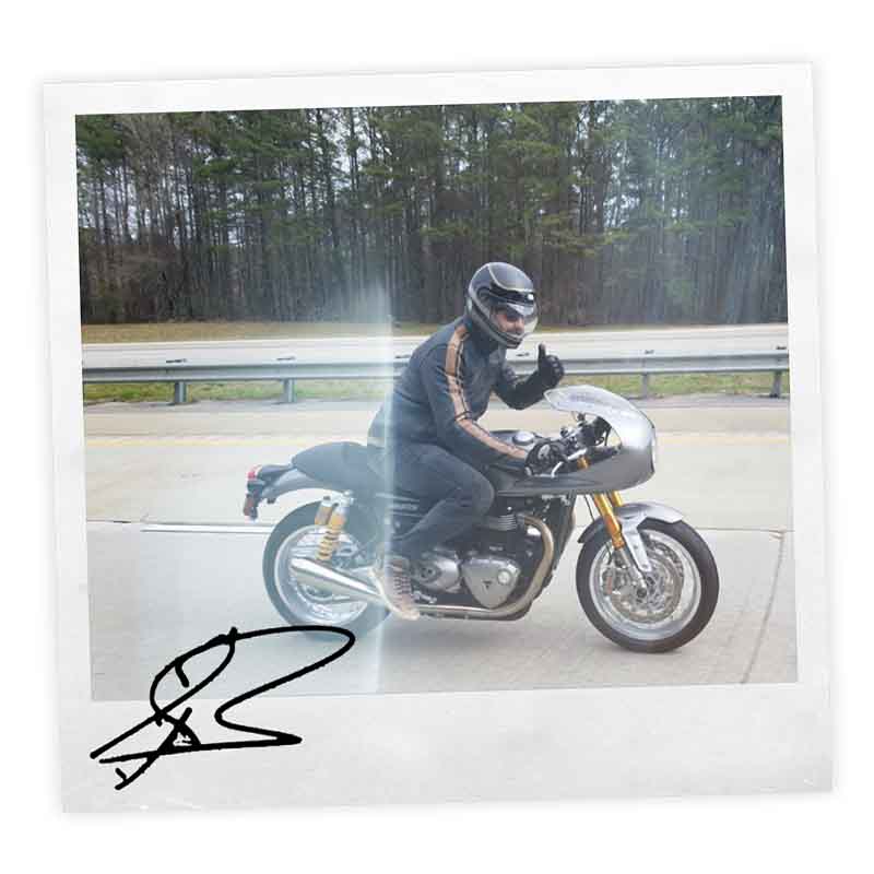 Signed polaroid of Gerald Butler with his Thruxton RS