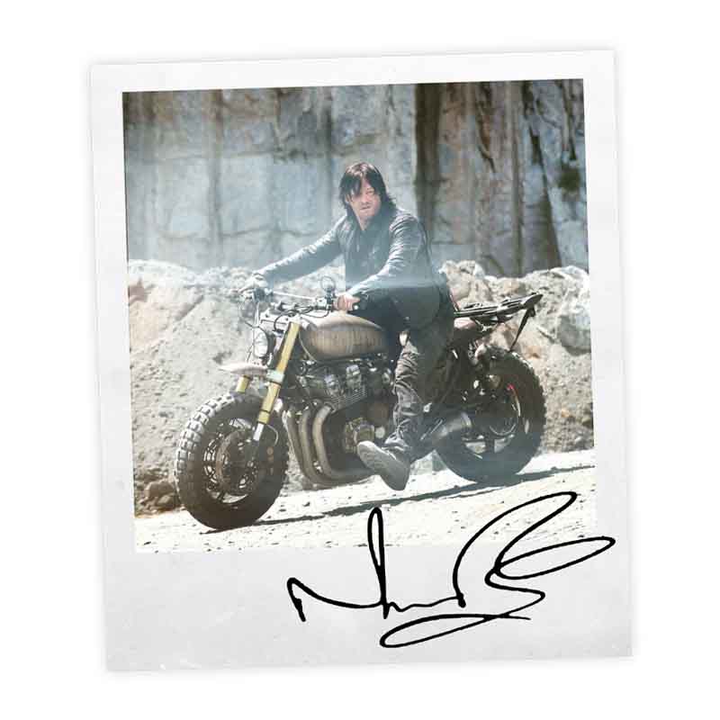 Signed polaroid of Norman Reedus with his Honda CB750