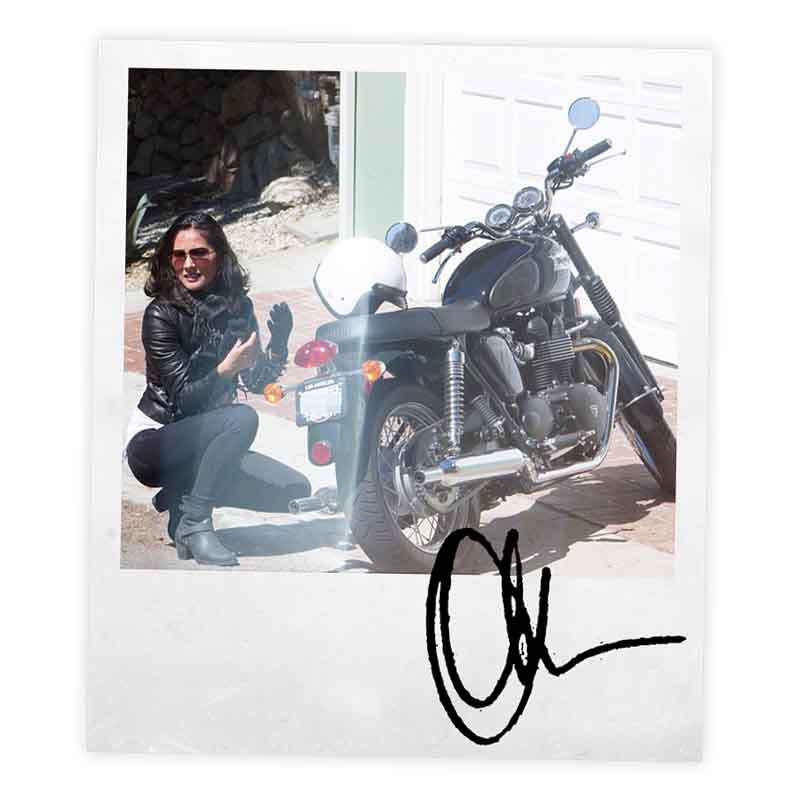 Signed polaroid of Olivia Munn with her Bonneville T100