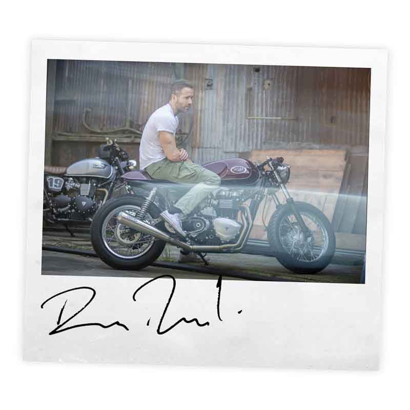 Signed polaroid of Ryan Renolds with his Triumph Thruxton